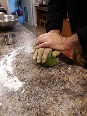 Kneading the dough for the green algae noodles
